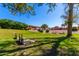 Scenic community park with lush green grass, horseshoe pits, and shade offering a tranquil escape at 8500 E Southern Ave # 447, Mesa, AZ 85209