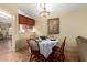 Cozy dining area with charming table, chairs, overhead light, and decorative artwork at 8500 E Southern Ave # 447, Mesa, AZ 85209