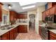 Well-equipped kitchen featuring stainless steel appliances, wood cabinets, and bright lighting at 8500 E Southern Ave # 447, Mesa, AZ 85209