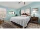 Charming main bedroom with light blue walls, a four-poster bed, and tile floors at 8500 E Southern Ave # 447, Mesa, AZ 85209
