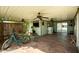 Spacious covered patio with ceiling fans, bar area, television, and comfortable seating perfect for entertaining at 8500 E Southern Ave # 447, Mesa, AZ 85209