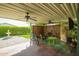 Covered patio with ceiling fans and comfortable seating with a garden view at 8500 E Southern Ave # 447, Mesa, AZ 85209