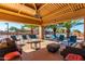 Community poolside lounge with comfortable seating, tables, and shade perfect for relaxation at 8500 E Southern Ave # 447, Mesa, AZ 85209
