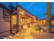 Charming desert home with spiral staircase, landscaped yard, stepping stone path, and covered patio at 8541 E Canyon Estates Cir, Gold Canyon, AZ 85118