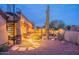 Desert home featuring a spiral staircase, landscaped yard, stone walkway, and outdoor entertaining area at 8541 E Canyon Estates Cir, Gold Canyon, AZ 85118
