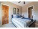 Bedroom featuring a warm color palette, wood accents, and inviting natural light at 8541 E Canyon Estates Cir, Gold Canyon, AZ 85118