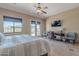 Bedroom with sitting area, patio access, tile floors and a ceiling fan at 8541 E Canyon Estates Cir, Gold Canyon, AZ 85118
