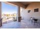 Spacious covered patio with an outdoor seating area and desert landscaping at 8541 E Canyon Estates Cir, Gold Canyon, AZ 85118