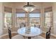 Bright dining area with decorative table and chairs and views of the backyard at 8541 E Canyon Estates Cir, Gold Canyon, AZ 85118