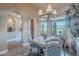 Charming dining area featuring chandelier, views to the backyard, and easy access to other rooms at 8541 E Canyon Estates Cir, Gold Canyon, AZ 85118