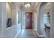 Elegant entryway with a decorative archway and dining room view at 8541 E Canyon Estates Cir, Gold Canyon, AZ 85118