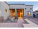 Inviting front entrance of a home, with a wooden front door and desert landscaping at 8541 E Canyon Estates Cir, Gold Canyon, AZ 85118