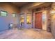 Welcoming front porch featuring an outside seating area with a stone accent wall at 8541 E Canyon Estates Cir, Gold Canyon, AZ 85118