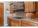 Kitchen counter featuring granite countertops and stone range hood at 8541 E Canyon Estates Cir, Gold Canyon, AZ 85118