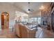 Open living space featuring a fireplace, comfortable seating, and seamless access to the kitchen at 8541 E Canyon Estates Cir, Gold Canyon, AZ 85118