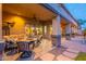 Cozy covered patio features plush seating, a ceiling fan, and stylish stone accents, perfect for relaxing at 8541 E Canyon Estates Cir, Gold Canyon, AZ 85118