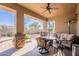 Inviting outdoor patio with comfortable seating and a cozy fire pit for relaxation and entertaining at 8541 E Canyon Estates Cir, Gold Canyon, AZ 85118