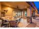 This inviting covered patio is perfect for relaxing with comfortable seating and seamless indoor/outdoor living at 8541 E Canyon Estates Cir, Gold Canyon, AZ 85118
