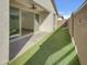 Charming backyard featuring a covered patio, artificial turf and a privacy fence at 9327 E Static Ave, Mesa, AZ 85212