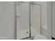Bathroom featuring a walk-in shower enclosed by sleek glass doors and modern fixtures at 9327 E Static Ave, Mesa, AZ 85212