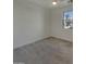 Bright bedroom with neutral carpet and walls and a large window at 9327 E Static Ave, Mesa, AZ 85212