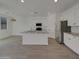 Modern kitchen with stainless steel appliances, granite counters, and a center island at 9327 E Static Ave, Mesa, AZ 85212