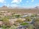 Beautiful desert community home with a circular drive, manicured lawn, and a stunning mountain backdrop at 9513 N 129Th Pl, Scottsdale, AZ 85259