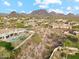 Desert home featuring a private pool, well-maintained landscaping, and beautiful mountain views at 9513 N 129Th Pl, Scottsdale, AZ 85259