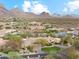 Desert residence featuring a landscaped yard, circular driveway, and breathtaking views of the nearby mountains at 9513 N 129Th Pl, Scottsdale, AZ 85259