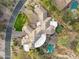 Aerial view of the estate, featuring a beautiful pool and putting green at 9513 N 129Th Pl, Scottsdale, AZ 85259