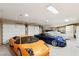 Spacious four car garage with high ceilings and updated lighting at 9513 N 129Th Pl, Scottsdale, AZ 85259