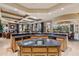 Kitchen island with a built-in sink and granite countertops, perfect for food preparation at 9513 N 129Th Pl, Scottsdale, AZ 85259