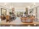 Grand living and dining area with a fireplace and a view of the mountain at 9513 N 129Th Pl, Scottsdale, AZ 85259