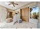 Open main bathroom with dual vanities, glass block partition, and tiled flooring at 9513 N 129Th Pl, Scottsdale, AZ 85259