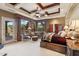 Expansive main bedroom with a seating area, and ample natural light from multiple windows at 9513 N 129Th Pl, Scottsdale, AZ 85259