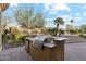 Outdoor kitchen with built-in grill, counter space, and convenient amenities at 9513 N 129Th Pl, Scottsdale, AZ 85259