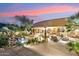 Expansive patio with a pool, lush landscaping, and multiple seating areas ideal for outdoor entertaining at 9513 N 129Th Pl, Scottsdale, AZ 85259