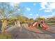 A community play area with playground equipment, basketball court, and shaded picnic tables at 9513 N 129Th Pl, Scottsdale, AZ 85259