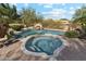 Beautiful backyard pool and spa area with brick pavers and desert landscaping at 9513 N 129Th Pl, Scottsdale, AZ 85259