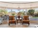 Comfortable sitting area with picturesque mountain views through large windows at 9513 N 129Th Pl, Scottsdale, AZ 85259
