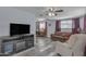 Comfortable living room featuring wood floors and large screen TV at 986 Leisure World --, Mesa, AZ 85206