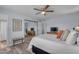 Comfortable main bedroom with neutral walls, wood-look floors, ceiling fan, and a mirrored closet at 986 Leisure World --, Mesa, AZ 85206