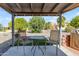 Cozy covered patio with seating offers a relaxing outdoor retreat overlooking landscaped yard at 986 Leisure World --, Mesa, AZ 85206