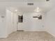 Open living room featuring white walls, tile flooring, closet and a door to the exterior at 10009 N 36Th Ave, Phoenix, AZ 85051