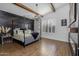 Serene bedroom featuring a canopy bed, wood beams, and a black accent wall at 10141 E Tamery Ave, Mesa, AZ 85212