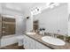 Bathroom with double sinks, granite countertop, soaking tub and shower with glass door at 10602 N 35Th St, Phoenix, AZ 85028