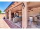 Inviting covered patio area featuring comfortable seating, ceiling fans, and stylish lighting at 10602 N 35Th St, Phoenix, AZ 85028