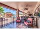 Large covered patio with stylish seating, a ceiling fan, and a view of the yard at 10602 N 35Th St, Phoenix, AZ 85028