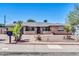 Charming single-story home boasting mature landscaping, a brick driveway, and welcoming curb appeal at 10602 N 35Th St, Phoenix, AZ 85028