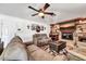 Comfortable living room with stone fireplace, wood accents, and neutral-toned furnishings at 10602 N 35Th St, Phoenix, AZ 85028